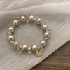Pulsera de doble propósito ~ banda de goma de perlas de alta gama para el cabello de mujer, cuerda para la cabeza de alta elasticidad, duradera, nueva de alta gama 2025