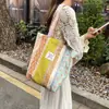Bolsa de mano de algodón floral estilo coreano, un bolso versátil y elegante que se puede llevar en la mano o colgar al hombro, perfecto para estudiantes mujeres, ligero y con gran capacidad, ideal para llevar libros a clase