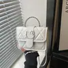 Bolso de mujer moderno y elegante 2026 nueva versión coreana, texturizado, a la moda, simple, color liso, bandolera con cadena, bolso pequeño cuadrado