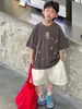 Tienda de Algodón Ropa de Verano para Niños Camiseta Versátil de Manga Corta para Niños 2026 Nuevo Estilo Coreano Resistente de Moda Lavada Moda Infantil