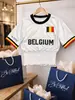 Transfronterizo Europeo y Americano Verano 2026 Nueva Llegada Camiseta con Estampado de Letras de Bandera Nacional Personalidad Femenina Dobladillo Fruncido Top Ajustado