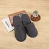 Hotel hogar Viaje Hospitalidad pantuflas desechables tema casa de huéspedes hotel pantuflas engrosadas tela al por mayor