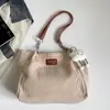 Bolso de mujer 2026 otoño nuevo estilo coreano mochila escolar para estudiante bolso de hombro simple y moderno bolso tote de gran capacidad para ir al trabajo