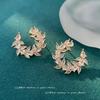 Pendientes elegantes de nicho con explosiones transfronterizas, hojas súper brillantes, pendientes ligeros de lujo con gran sentido, pendientes femeninos con diseño de personalidad
