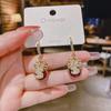 Pendientes de lazo de terciopelo rojo con ambiente de moda, temperamento femenino, flor dulce, borla larga, pendientes Joker al por mayor