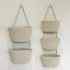 Cesta de armazenamento de brinquedos tecida com corda de algodão suspensa, cesta suspensa de armazenamento para decoração de porta, cesta de parede para miudezas domésticas, transfronteiriça