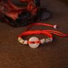 Venta al por mayor de fábrica pulsera de nudo rojo tejido imitación Jade hebilla de la paz vida segura auspicioso nudo rojo joyería al por mayor