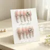 Uñas postizas hechas a mano estilo ojo de gato en tono rosa nude con degradado y pedrería grande, suaves y favorecedoras, estilo largo, adecuadas para el uso diario, piezas de uñas desmontables