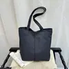 Bolso de mano unisex transfronterizo estilo minimalista casual para mujer, primavera y otoño, textura de color sólido, moderno, versátil, estudiante, para clase, de un solo hombro, bolsa grande