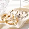 Pulsera Abierta Anillo Set Geométrico de Acero Inoxidable Chapado en Oro de 18K Estilo de Lujo Ligero Transfronterizo Europeo y Americano Zirconia Cúbica Colorida