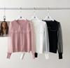 Suéter de punto de manga abullonada estilo francés otoño e invierno 2023, entallado y adelgazante, con diseño de cuello de muñeca, suéter de moda suéter
