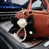 Nuevo Creativo Pequeño Camelia Fragante Llavero para Coche Moda Cadena de Cuentas Borde de Diamante Flor Colgante Decoración de Bolso Venta al por Mayor