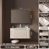 Mueble de baño cerámico integrado color crema con esquinas redondeadas, que incluye un mueble para lavabo y un lavabo sobre encimera