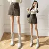Diseño Nuevo Otoño/Invierno 2026 Falda Pequeña de Cuero con Cintura Asimétrica para Mujer Falda Corta Bodycon de PU de Cintura Alta Línea A