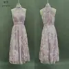 Moda europea y americana para mujer 2026 transfronteriza: vestido de malla ajustado con estampados, abertura asimétrica, diseño plisado y tirantes finos sexys, vestido largo