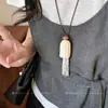 Collar de cordón de cuero con borla de cuentas y perlas, moda nicho de alta gama, cadena exquisita para suéter, simple y versátil, accesorio de lujo ligero