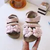 Sandálias Infantis 2026 Primavera Novas Sapatos de Praia com Solado Macio para Crianças Menina Bebê Sandálias Estilosas de Flor Princesa
