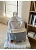 Mochila escolar transfronteriza nueva de alto valor para niñas, mochila de retazos de nicho para estudiantes, bolsa de doble hombro ligera de gran capacidad para estudiantes de secundaria y preparatoria