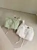 WGWE9176 Guangzhou Trece Líneas Ropa para Mujer Verano 2026 Nuevo Top Camisa de Manga Corta con Cordones de un Hombro