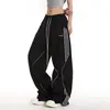 Pantalones casuales funcionales negros para hombres y mujeres, estilo callejero retro americano, geniales y elegantes, pantalones de pierna curva para primavera y otoño, pantalones deportivos a rayas de moda