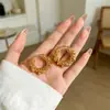 Aretes de clip de lujo ligero de moda, brazaletes para oreja versátiles, temperamento, personalidad, modernos, aretes de celebridad de internet, aretes pequeños exquisitos, al por mayor, oro