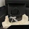 Moda Nueva Primavera/Verano 2026 Encaje Simple Versátil Elegante Lazo Un Hombro Cruzado de Hombro de Mano Bolso de Bolos Cruzado