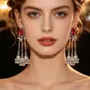 Pendientes de borla con campana de estilo indio vintage superventas transfronterizos, pendientes de lujo ligero con adornos de cristal en forma de gota de agua de estilo étnico