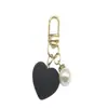 Lindo Colgante Llavero Corazón de Resina Multicolor Perla Versátil Femenino Colgante Corazón de Durazno Accesorio para Bolso Teléfono