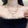 Collar de doble capa de perlas de estilo francés, estilo puro deseo, sexy, de moda, de entrada, de lujo, socialité, elegante, elegante, de alta clase, cadena de clavícula de moda.