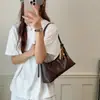 Bolso tipo baguette japonés y coreano con un toque de alta gama para uso diario, nuevo modelo de verano 2026 para mujer, bolso de hombro único de alta gama y bolso de axila