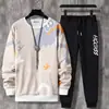 Estudantes jovens masculino moderno primavera e outono nova estampa esportivo lazer duas peças manga longa gola redonda terno atacado