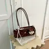 Bolso de hombro con lazo de lunares de moda transfronterizo para mujer, nuevo y elegante bolso de hombro de nicho 2026, bolso de trabajo