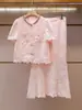 Shenzhen Nanyou Moda Feminina de Luxo Verão Novo Estilo Elegante Renda Strass Manga Curta Conjunto de Blusa e Saia