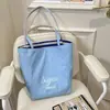 Bolsa de punto a rayas estilo perezoso de primavera y verano, estilo coreano para chicas, moda moderna, bolsa de compras de gran capacidad, bolsa tipo tote