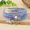 Pulsera multicapa de estilo bohemio oceánico europeo y americano con conchas, tortugas, colas de pez y cuentas de semillas para mujer, pulsera elástica apilable de cuentas de semillas