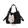 Bolso de nicho vintage para mujer, nuevo modelo de verano 2026, bolso tipo cubo simple, alto valor estético, bolso cruzado de color liso