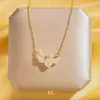 Campanilla de viento de nuevo estilo de solsticio de verano Colgante de flor de lirio Collar con corazón Personalidad retro Concha real Trébol de cuatro hojas Cadena de clavícula exquisita de celebridad de Internet