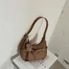 Bolso de mano de color liso para mujer, nuevo para principios de otoño 2026, bolso de hombro único cruzado de moda con patrón de lichi, bolso cruzado nuevo de verano