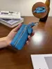 Bolsa para Llaves de Coche de Piel de Vaca Modelo Nuevo 2026 para Mujer Mini Bolsa Portátil de Almacenamiento Cartera para Llaves de Coche y Casa Mini Bolsa Colgante