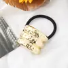 Estilo punk europeo y americano metal personalidad alta calidad cuerda para la cabeza semicírculo tubo redondo anillo para el pelo cuerda elástica para el pelo Balot fabricantes al por mayor