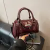 Bolso de mano de diseño nicho transfronterizo tipo Boston almohada textura de alta gama moderno bandolera
