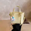 Bolso Bandolera Texturizado en Relieve Estilo Coreano Transfronterizo para Mujer Modelo Nuevo 2026 Bolso de Hombro Simple Versátil Bolso de Mano de Moda Bolso Cubo
