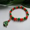 Pulseira de Natal Transfronteiriça Europeia e Americana Nova com Pingente de Papai Noel Boneco de Neve Pulseira Ajustável de Contas Vermelhas e Verdes para Mulheres