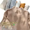 Camiseta básica de punto para mujer con cuello medio alto para otoño e invierno, nuevo suéter elegante de corte ajustado 2026 con mangas largas estampadas
