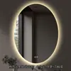 Espejo de baño inteligente de forma ovalada con retroiluminación LED, adecuado para baños de hotel; espejo de maquillaje antivaho; personalizable