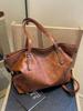 2024 Sacola de grande capacidade Bolsa geral retrô da moda Bolsa de ombro casual simples de grande capacidade Bolsa transversal estilo ocidental da moda