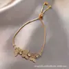 Ebay Pulseira de puxar com zircônia de três borboletas transfronteiriça europeia e americana pulseira geométrica da moda feminina atacado em estoque
