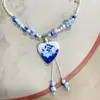 Collar con colgante de campana de mariposa de cerámica de estilo étnico retro para mujer, diseño nuevo y moderno, cadena larga para suéter, accesorios
