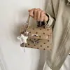 Bolsa de Mão Estilo Coreano Feminina 2026 Outono/Inverno Nova Moda Bolinhas Fechamento com Trava de Commuter Alça Superior Bolsa Kelly Bolsa de Ombro Transversal Feminina