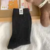 Calcetines de otoño e invierno para mujer, calcetines Maillard de media pantorrilla, calcetines largos de tela con etiqueta coreana vintage, calcetines apilados de hilo moteado de color liso